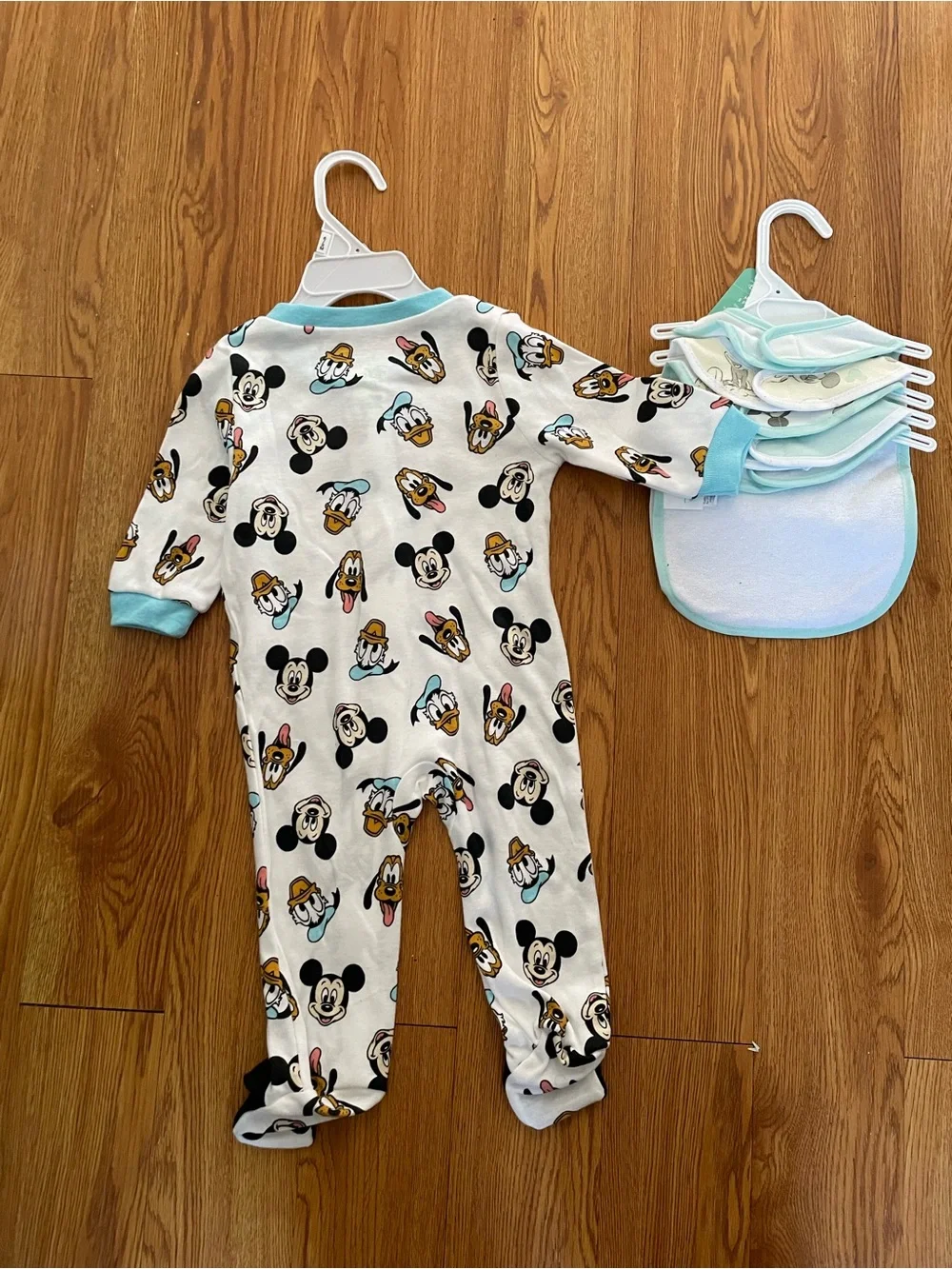 Disney baby footed sleeper and matching bibs